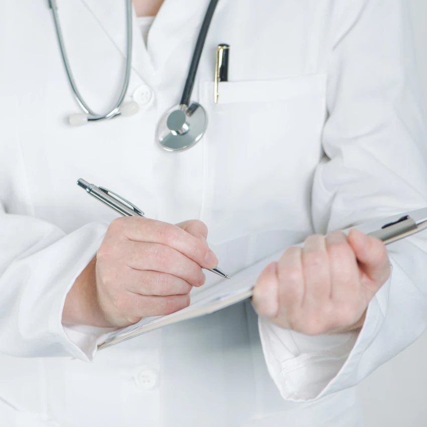 medical-professional-writing-on-clipboard